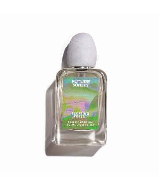 Perfume bottle labeled "Floating Forest" on white background