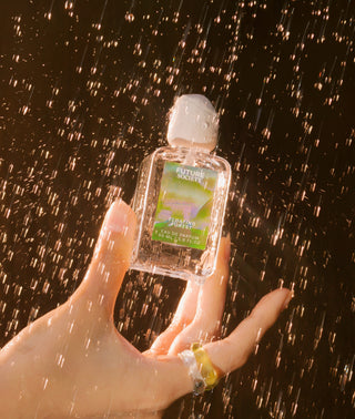 Hand holding Floating Forest eau de Parfum