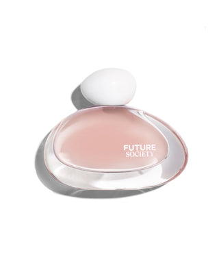 A Solar Canopy perfume bottle with a translucent clear body, pale pink liquid, and a white spherical cap, photographed on a white background with a soft shadow. The bottle is labeled 'FUTURE SOCIETY'.