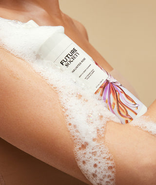 Haunted rose body cleanser model with suds on arm